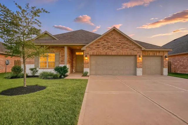 a view of a house with a swimming pool and a yard