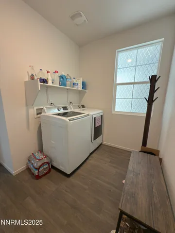 a room with a wooden floor and a sink