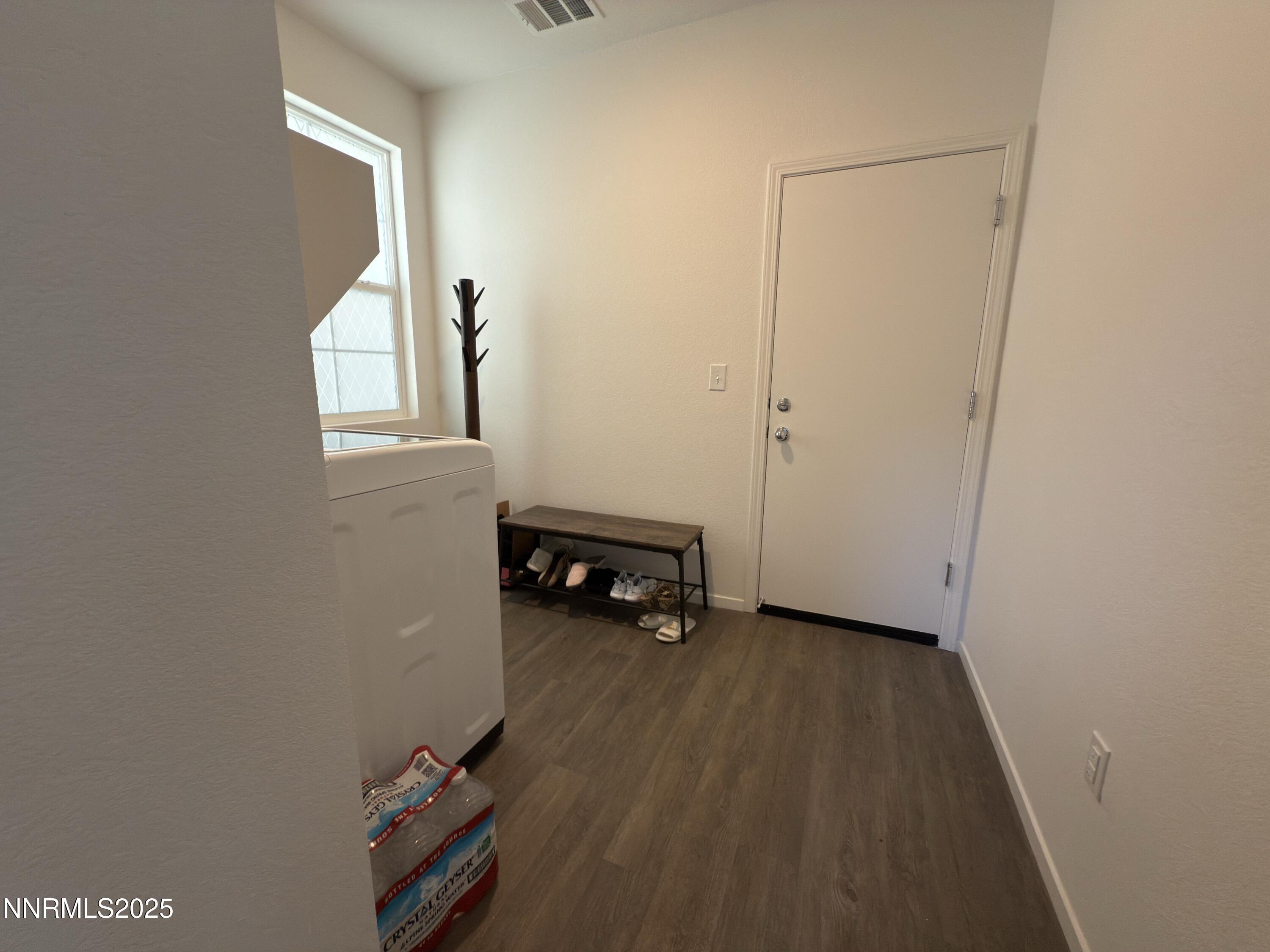 9774 Silver Dollar Lane Reno, NV 89506 - Photo 12 of 26 a view of a room with wooden floor and a window
