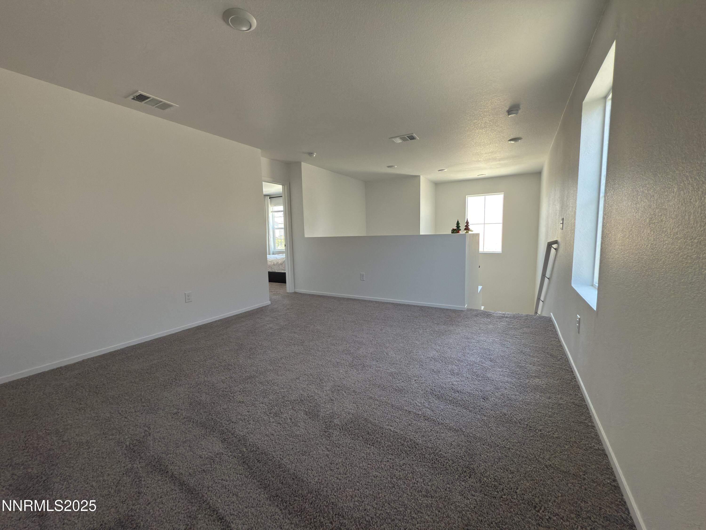 9774 Silver Dollar Lane Reno, NV 89506 - Photo 16 of 26 a view of empty room