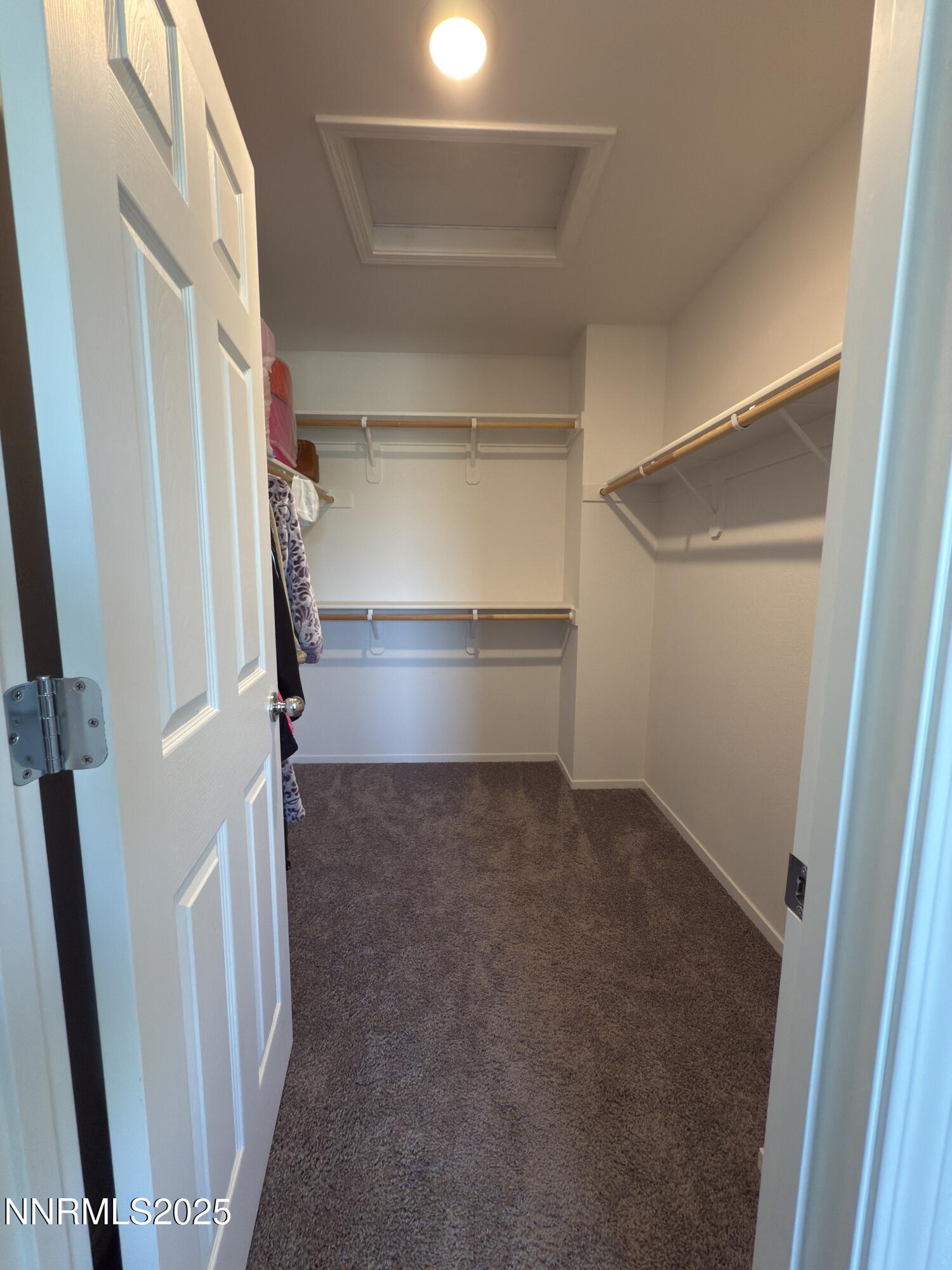 9774 Silver Dollar Lane Reno, NV 89506 - Photo 18 of 26 a view of walk in closet with empty racks