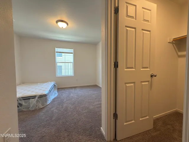 an empty room that has a window in it