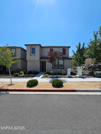 a house with a yard and a car parked in front of it