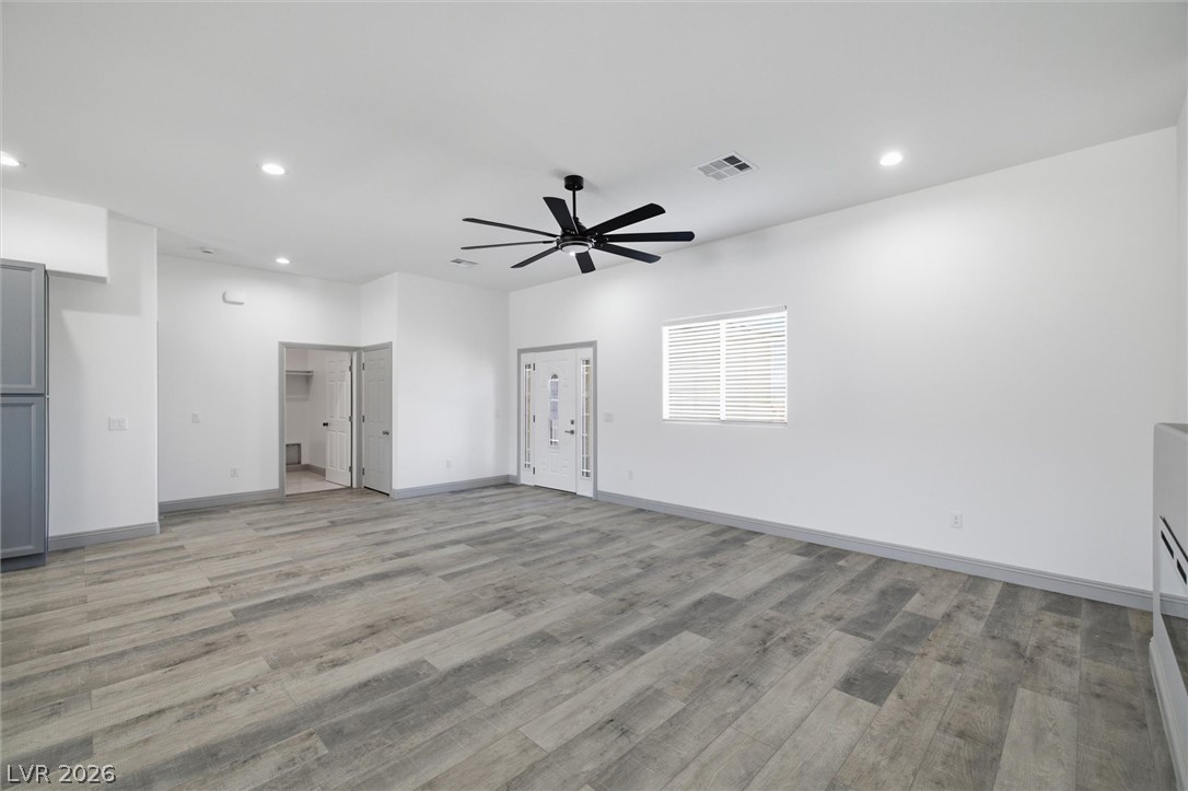 1061 Factory Road Pahrump, NV 89048 - Photo 6 of 41 Enter into a spacious area boasting light wood flooring and modern recessed lighting.