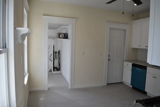 a view of a hallway with closet and entryway