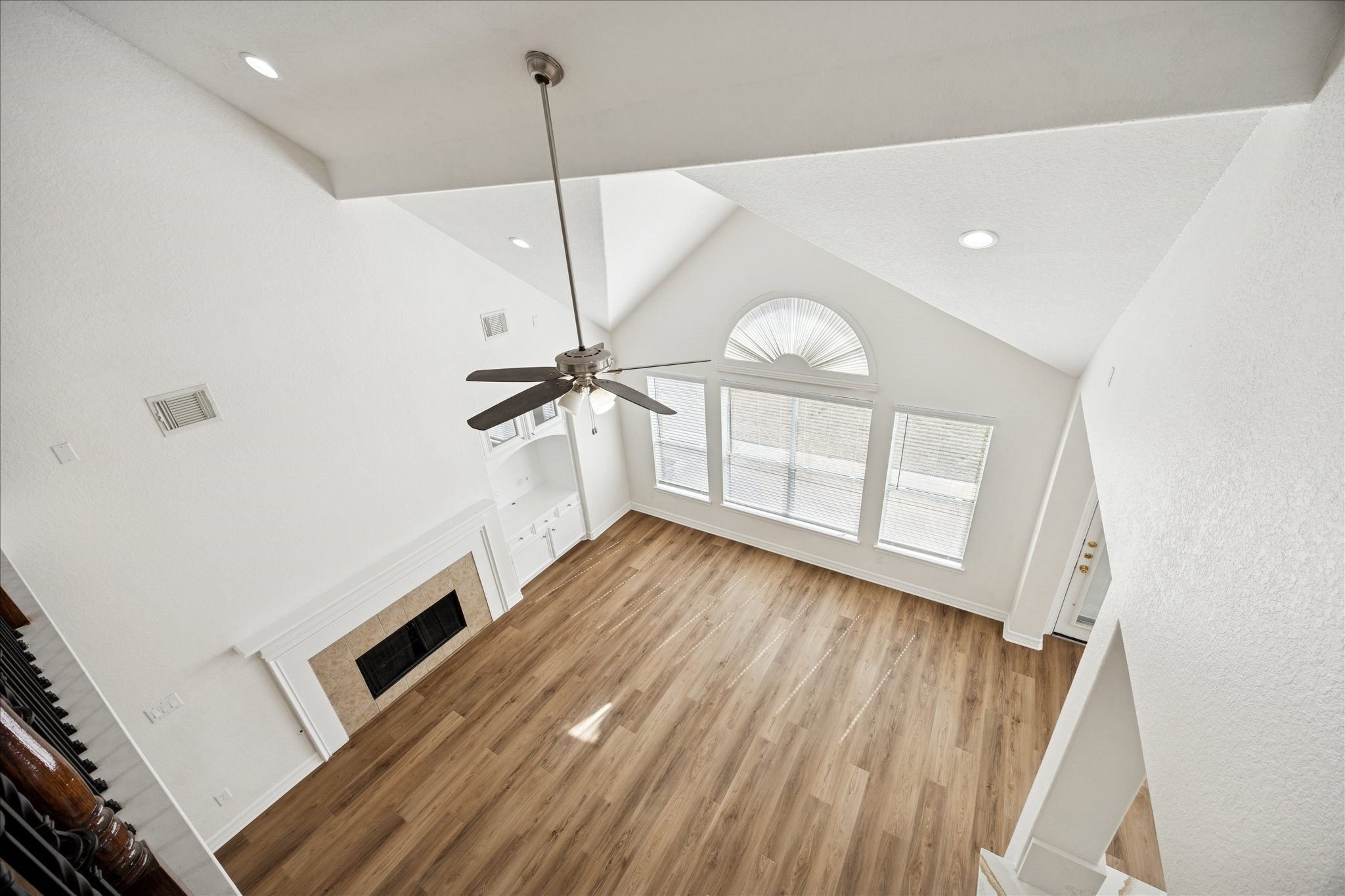 12003 Ensenada Canyon Lane Houston, TX 77041 - Photo 14 of 28 View of the downstairs living area from the upstairs landing, highlighting the open layout.