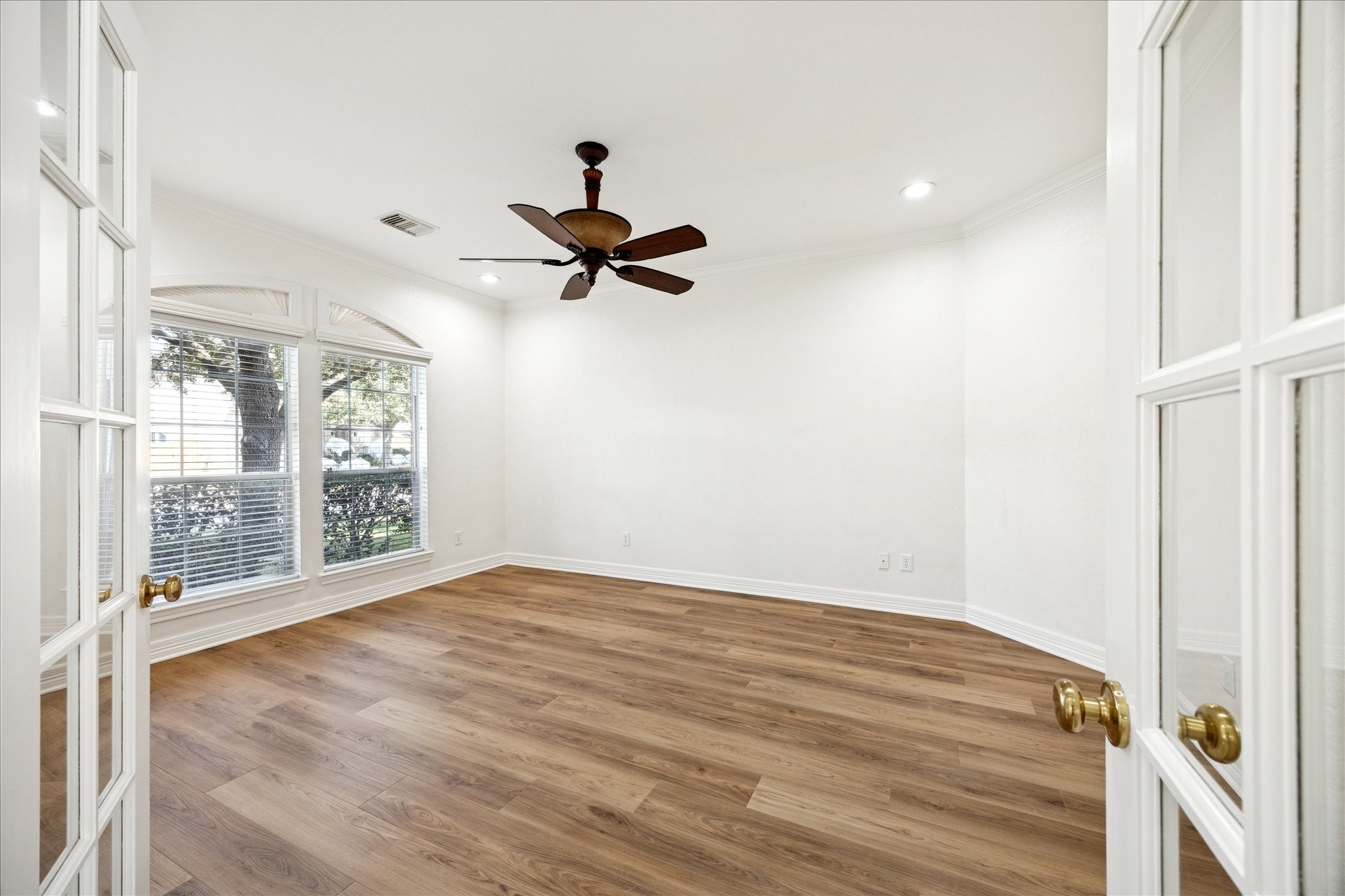 12003 Ensenada Canyon Lane Houston, TX 77041 - Photo 3 of 28 Private study with double doors and front yard views, ideal for a home office or quiet workspace.