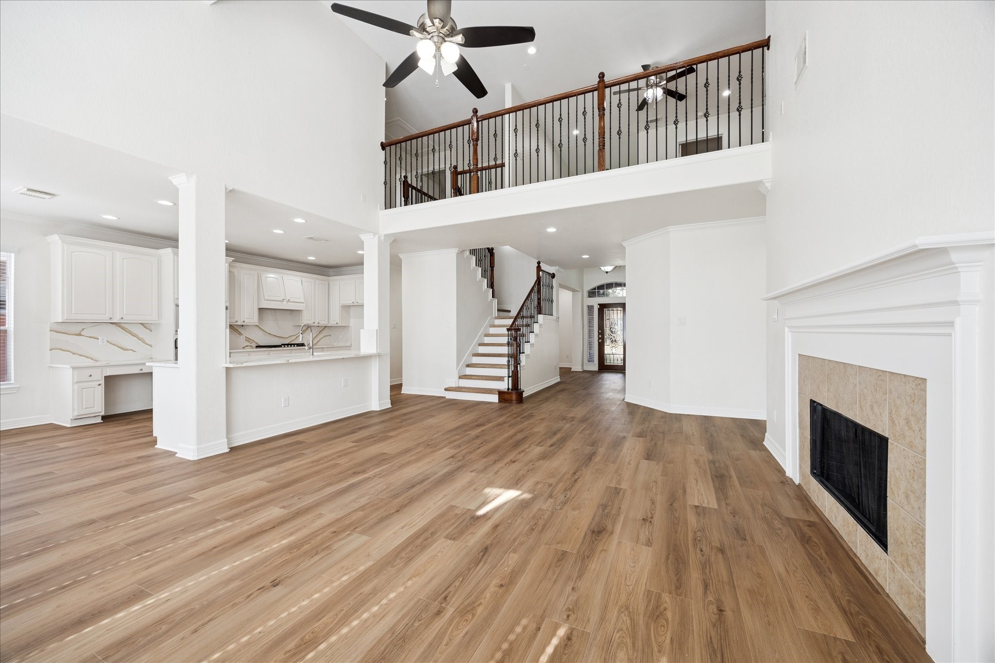 12003 Ensenada Canyon Lane Houston, TX 77041 - Photo 6 of 28 Alternate view of the living area showcasing the fireplace and open, easy access to the kitchen.