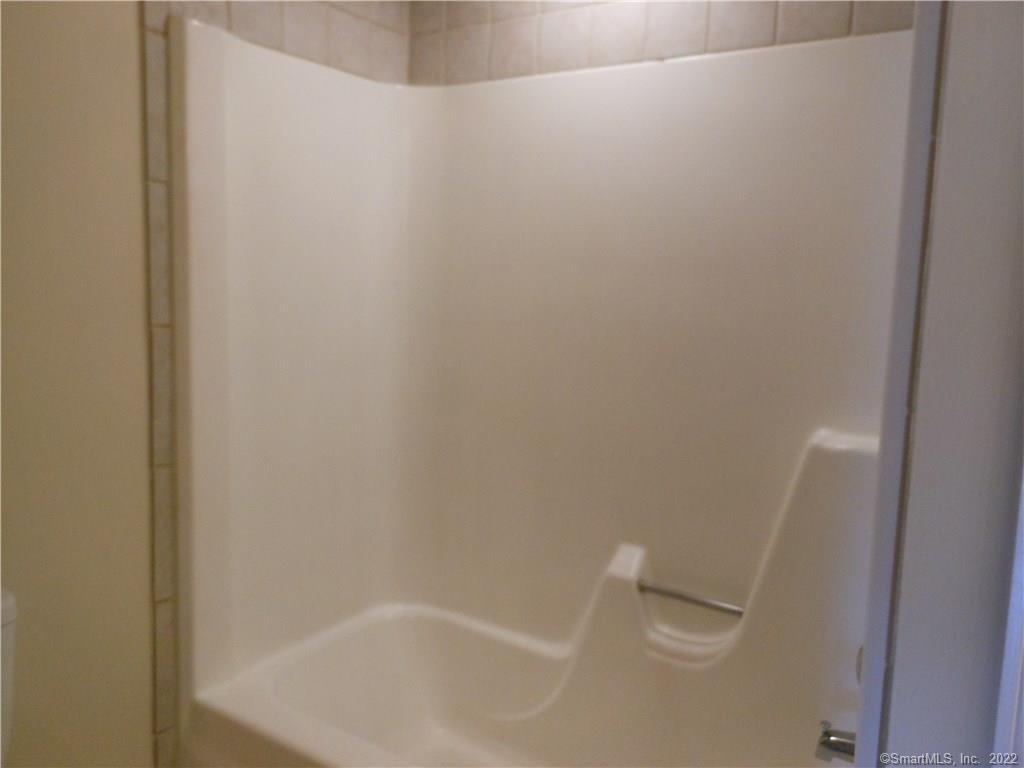 7 Padanaram Road, Unit C58 Danbury, CT 06811 - Photo 12 of 17 a close up of a bathtub