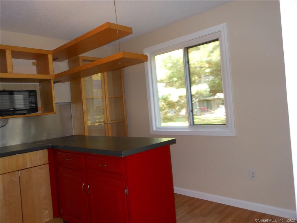 7 Padanaram Road, Unit C58 Danbury, CT 06811 - Photo 14 of 17 a kitchen with a large window