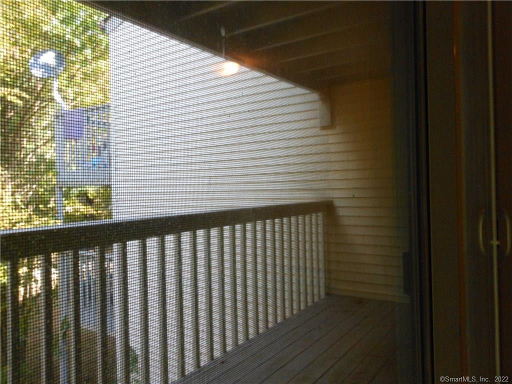 7 Padanaram Road, Unit C58 Danbury, CT 06811 - Photo 16 of 17 a view of a balcony with wooden floor