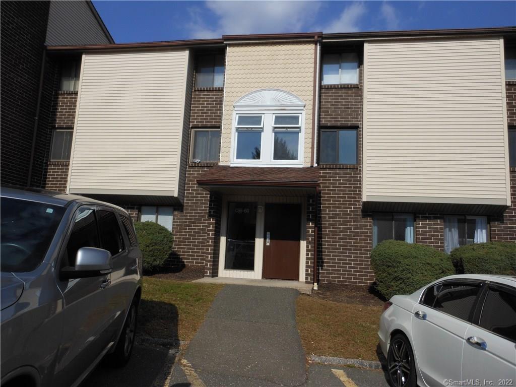 7 Padanaram Road, Unit C58 Danbury, CT 06811 - Photo 17 of 17 a front view of a house with balcony and car parked