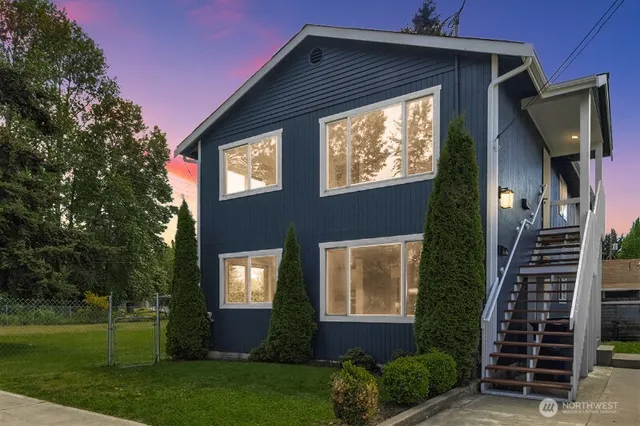 a front view of a house with garden