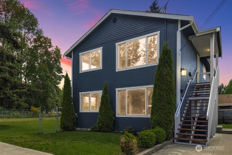 a front view of a house with garden