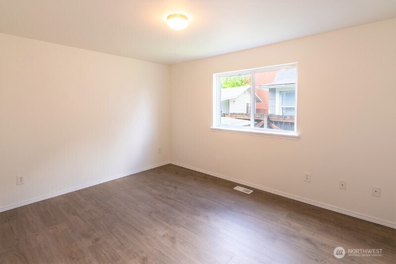 551 South Sullivan Street Seattle, WA 98108 - Photo 15 of 24 an empty room with a window