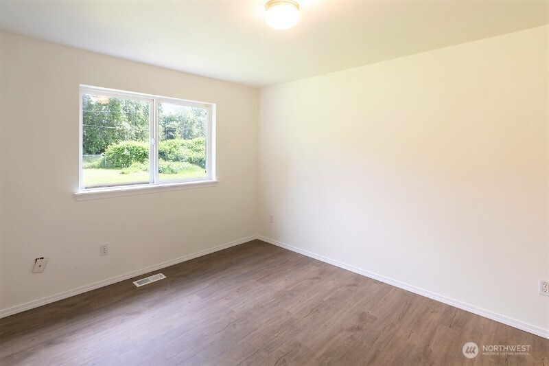551 South Sullivan Street Seattle, WA 98108 - Photo 16 of 24 an empty room with a window