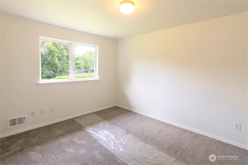 551 South Sullivan Street Seattle, WA 98108 - Photo 2 of 24 an empty room with a window