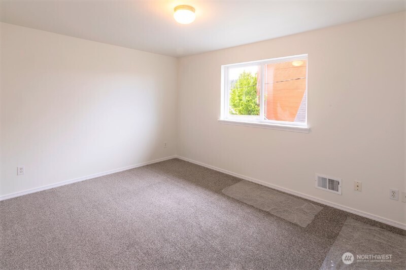 551 South Sullivan Street Seattle, WA 98108 - Photo 3 of 24 an empty room with a window