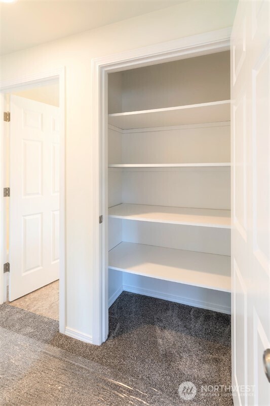 551 South Sullivan Street Seattle, WA 98108 - Photo 5 of 24 a view of a room with rack on the wall