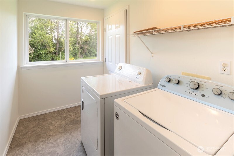551 South Sullivan Street Seattle, WA 98108 - Photo 7 of 24 a utility room with dryer and washer