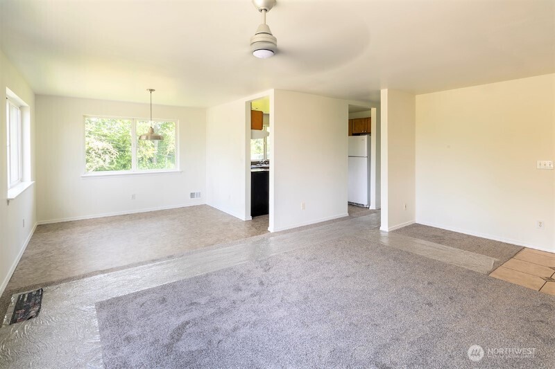 551 South Sullivan Street Seattle, WA 98108 - Photo 8 of 24 a view of an empty room with a window