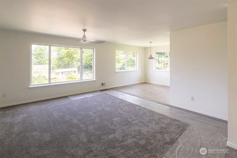 551 South Sullivan Street Seattle, WA 98108 - Photo 9 of 24 an empty room with windows and closet