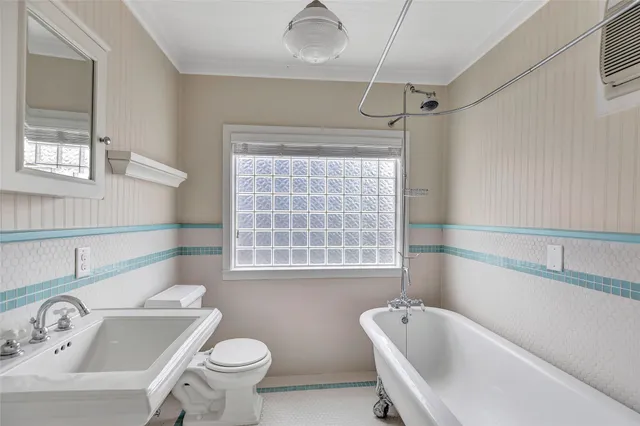 a view of a brick house with many windows