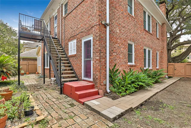 a view of staircase with wooden floor and a potted plant