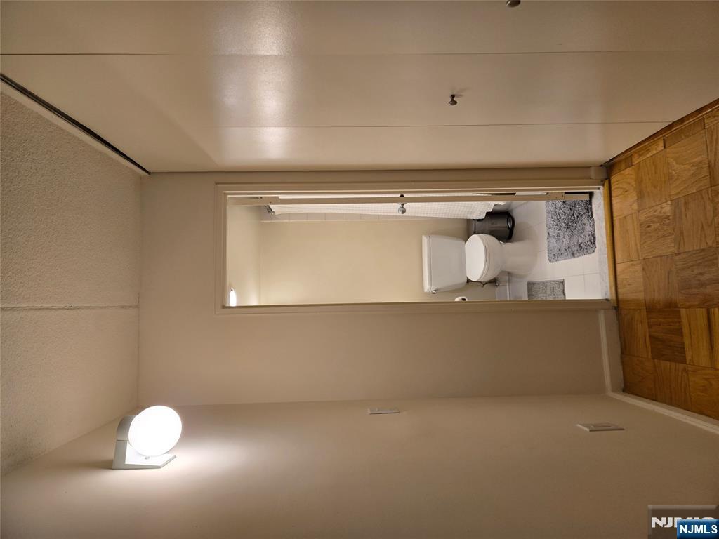 1275 15th Street, Unit PHB Fort Lee, NJ 07024 - Photo 12 of 14 a bathroom with a sink and a toilet