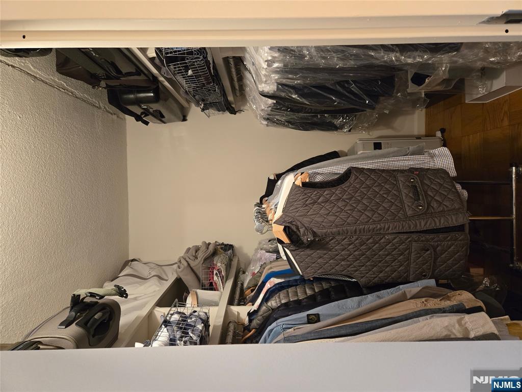 1275 15th Street, Unit PHB Fort Lee, NJ 07024 - Photo 14 of 14 a view of walk in closet with clothes and shoes