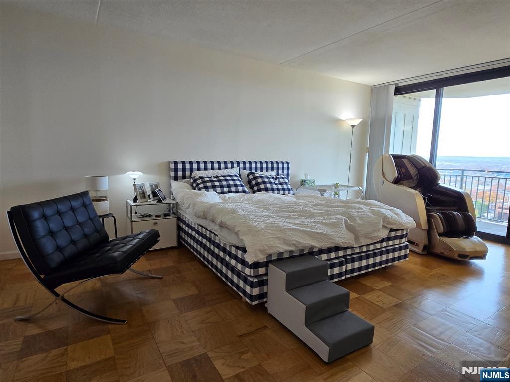 1275 15th Street, Unit PHB Fort Lee, NJ 07024 - Photo 7 of 14 a bedroom with a bed window and couch