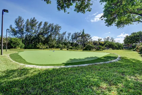 a view of a golf course with a lake