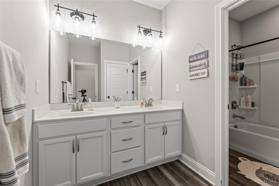2425 Middleboro Road Clarksville, OH 45113 - Photo 80 of 91 This bathroom features a double vanity and sleek fixtures for a clean, refreshing space.