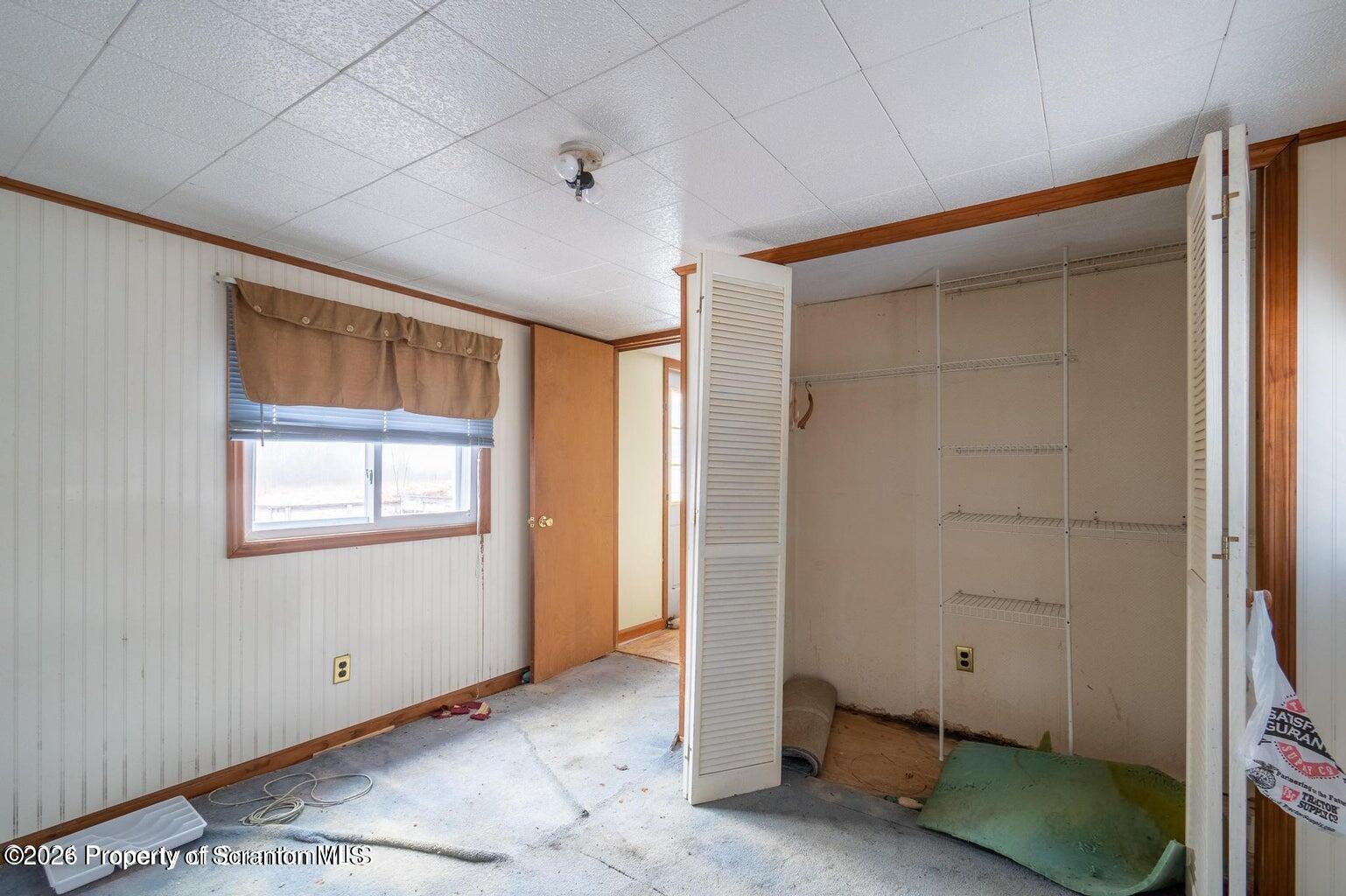 1777 Lamb Road Thompson, PA 18465 - Photo 19 of 31 an empty room with windows