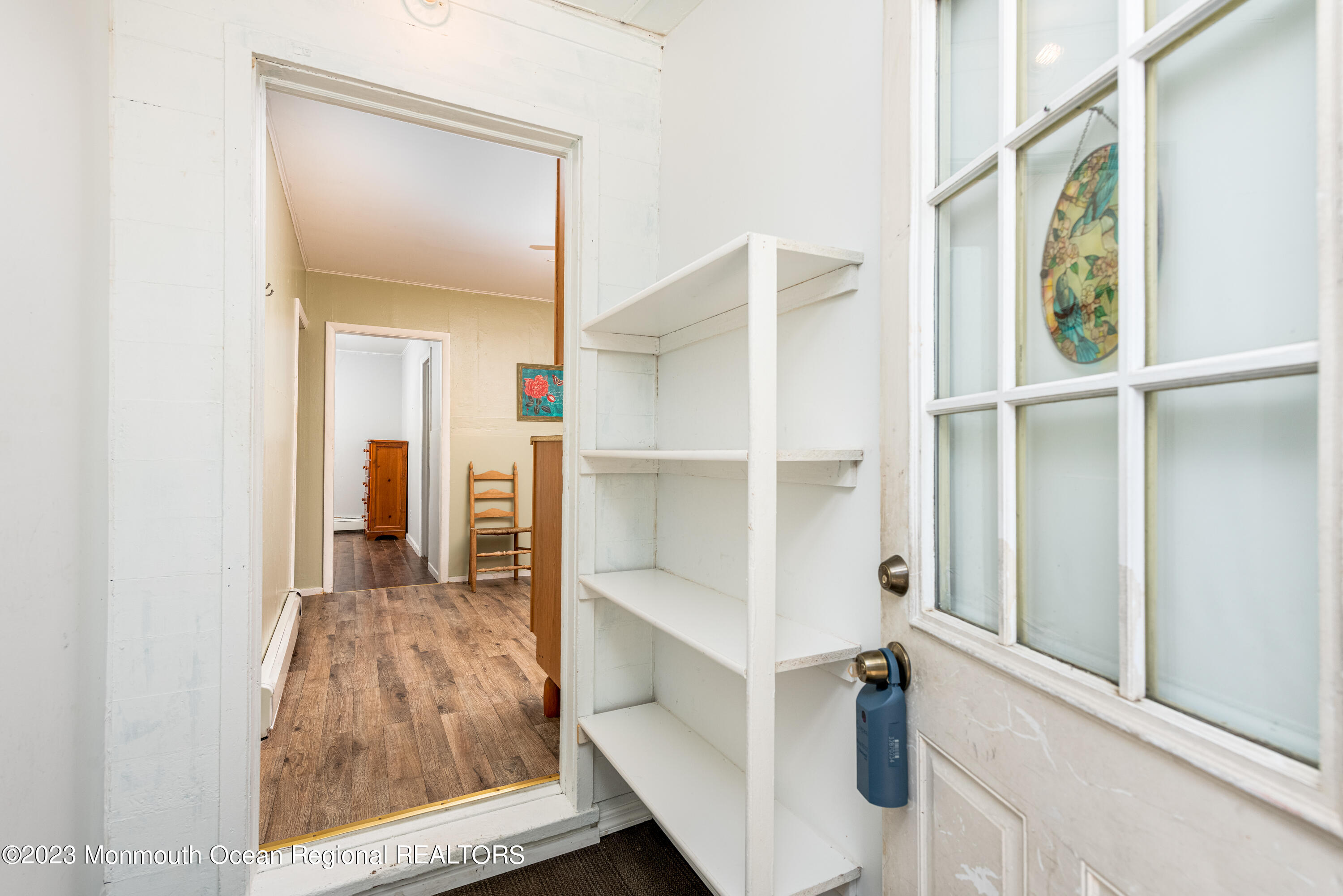 508 Georgia Tavern Road Howell, NJ 07731 - Photo 13 of 33 a view of a hallway with wooden floor and windows