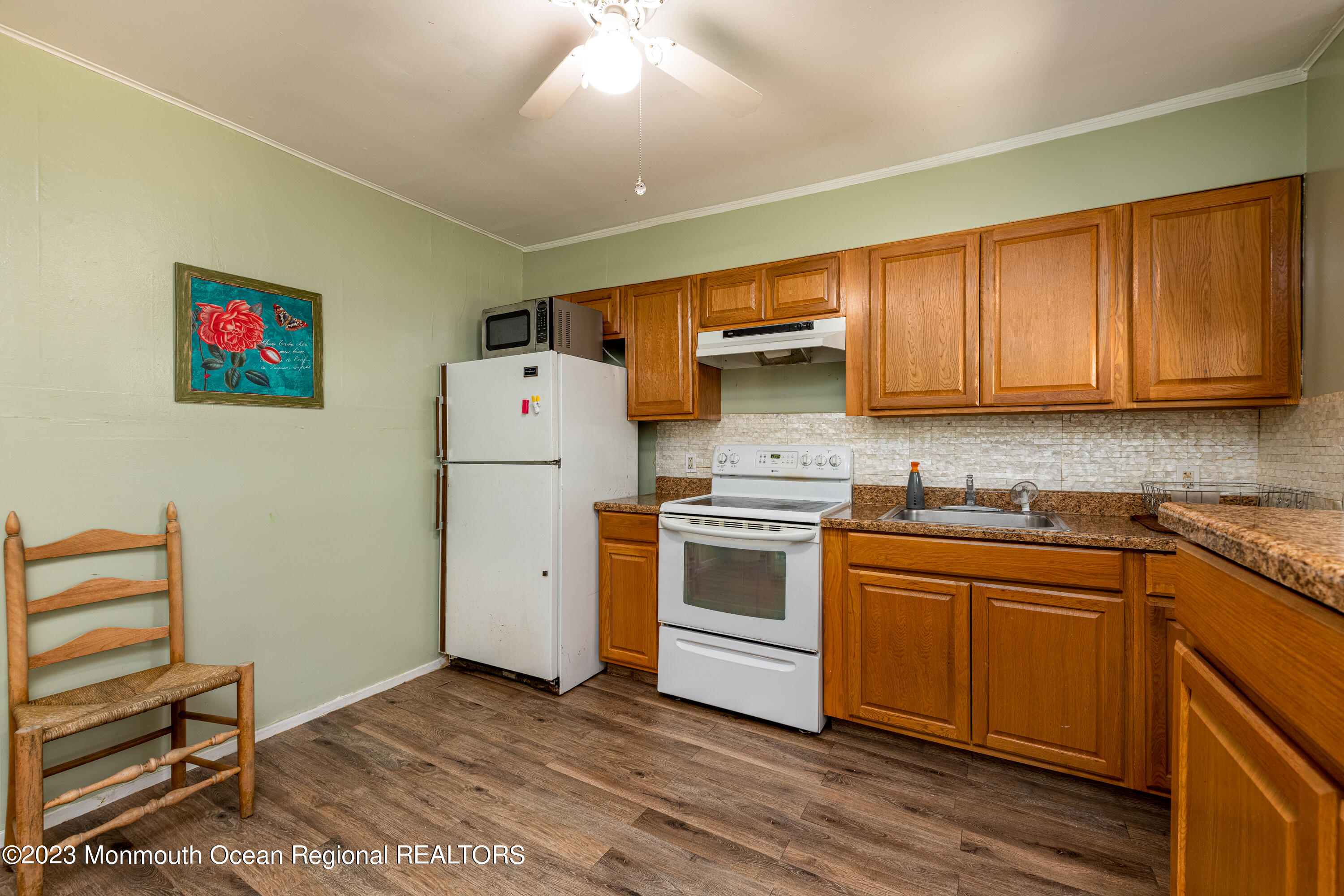 508 Georgia Tavern Road Howell, NJ 07731 - Photo 14 of 33 a kitchen with a white cabinets and white appliances