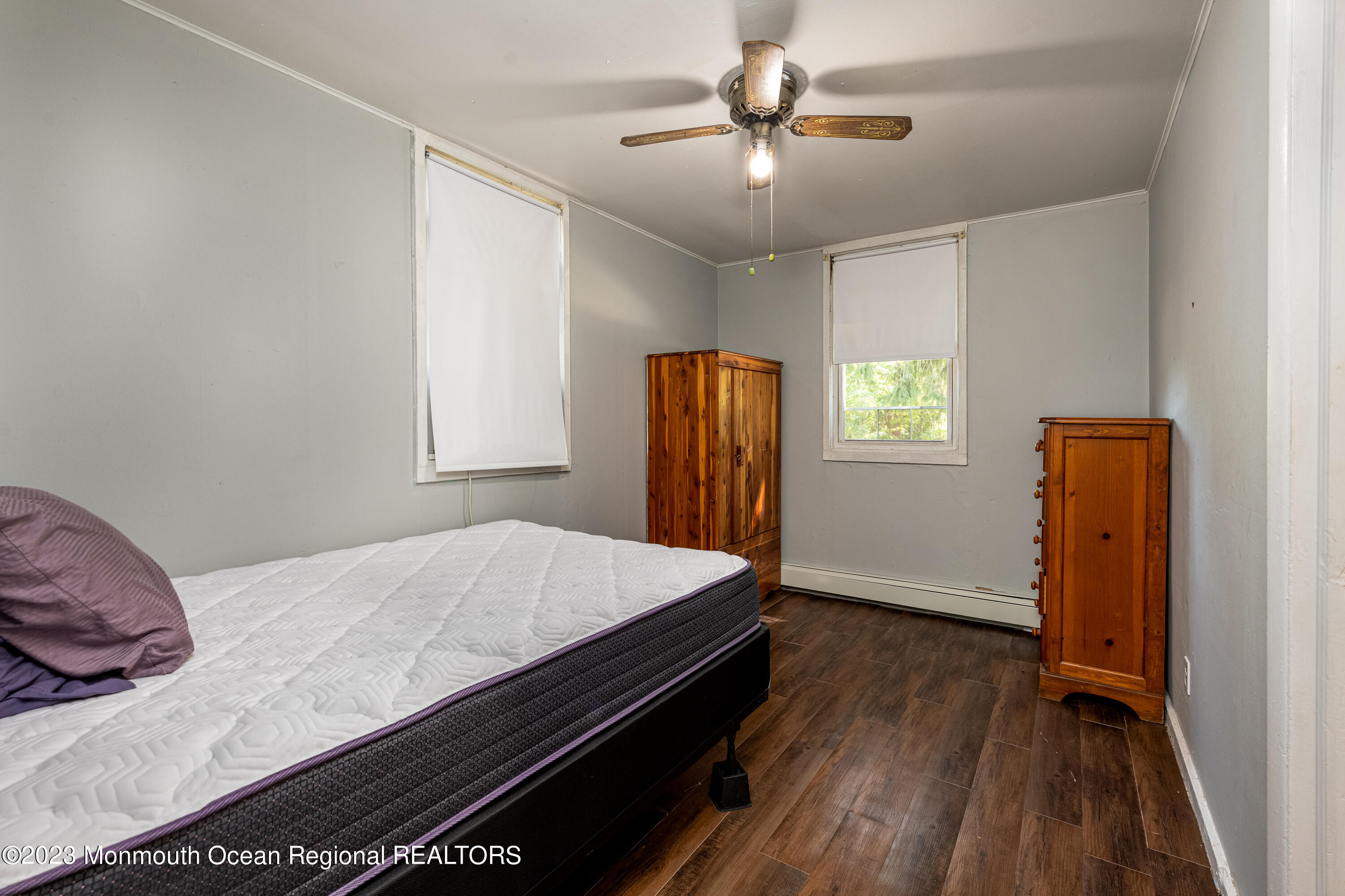 508 Georgia Tavern Road Howell, NJ 07731 - Photo 17 of 33 a bedroom with a bed and a chandelier