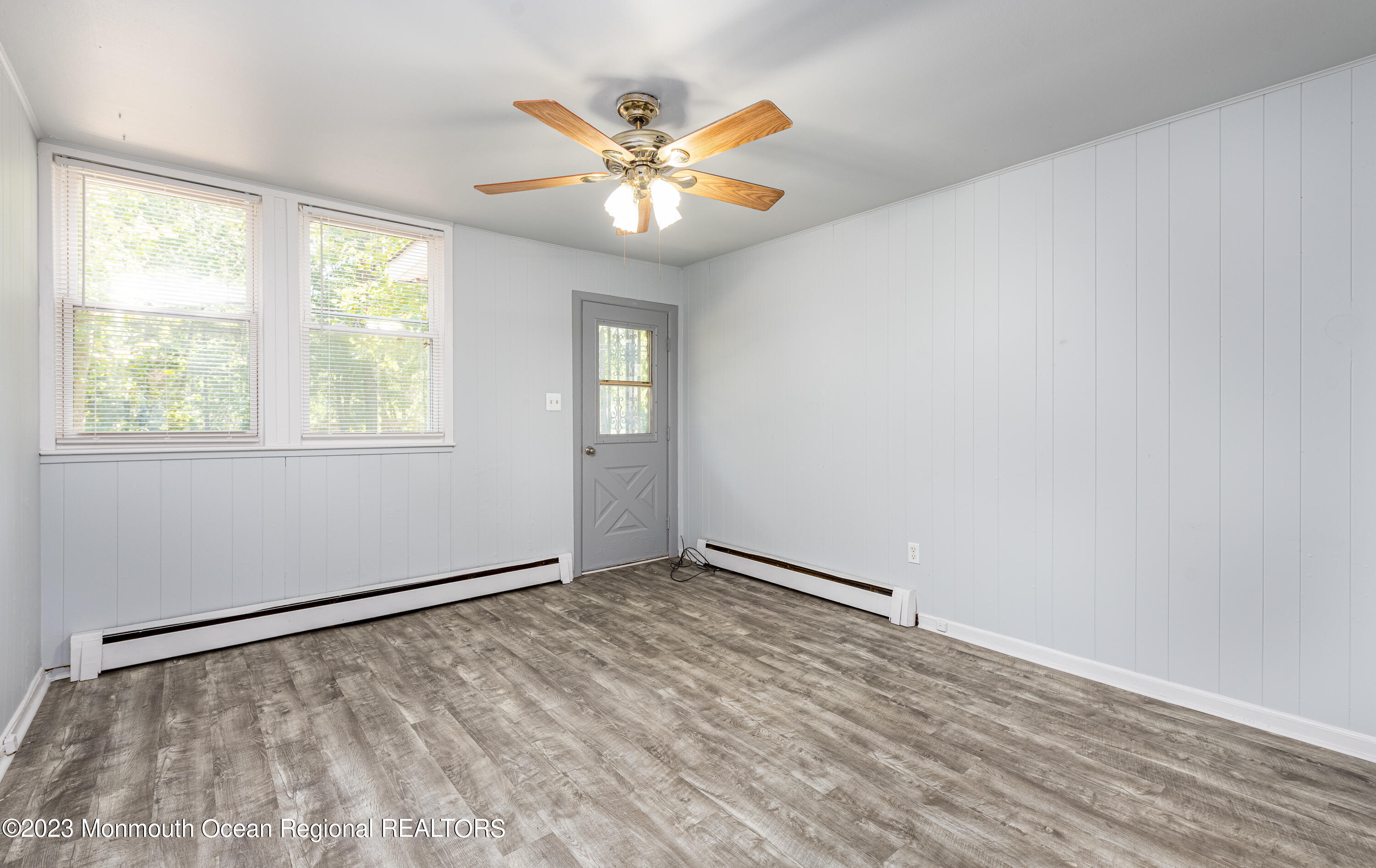 508 Georgia Tavern Road Howell, NJ 07731 - Photo 2 of 33 wooden floor in an empty room with a window