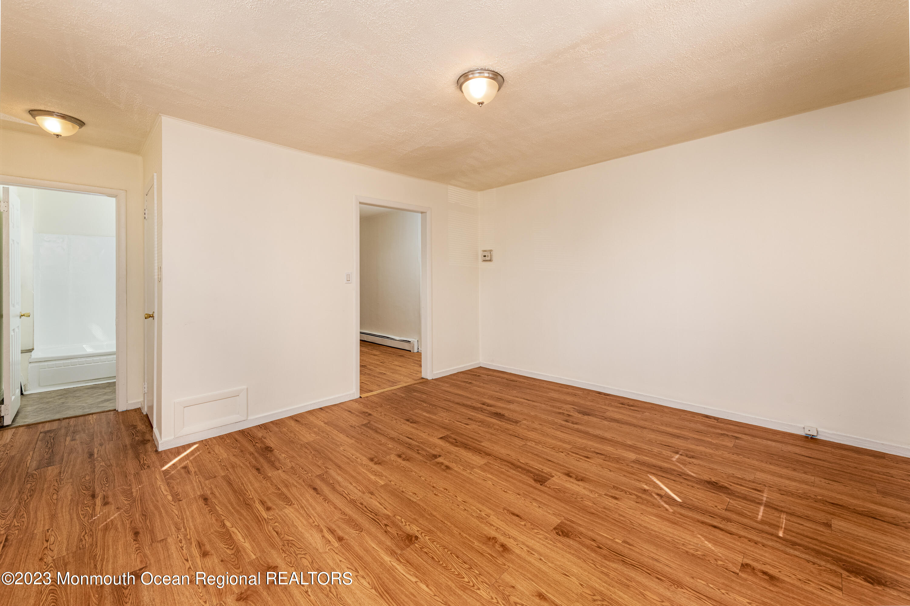 508 Georgia Tavern Road Howell, NJ 07731 - Photo 23 of 33 a view of empty room with wooden floor