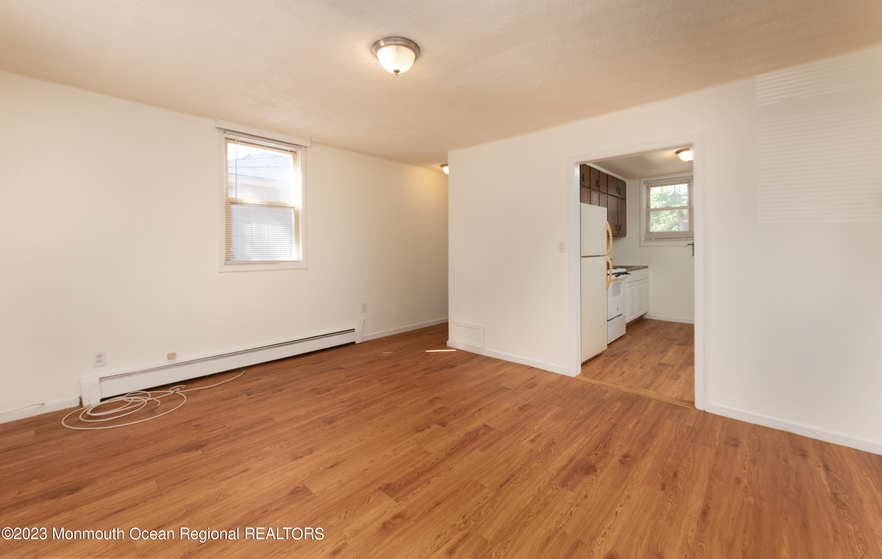 508 Georgia Tavern Road Howell, NJ 07731 - Photo 24 of 33 an empty room with wooden floor and windows