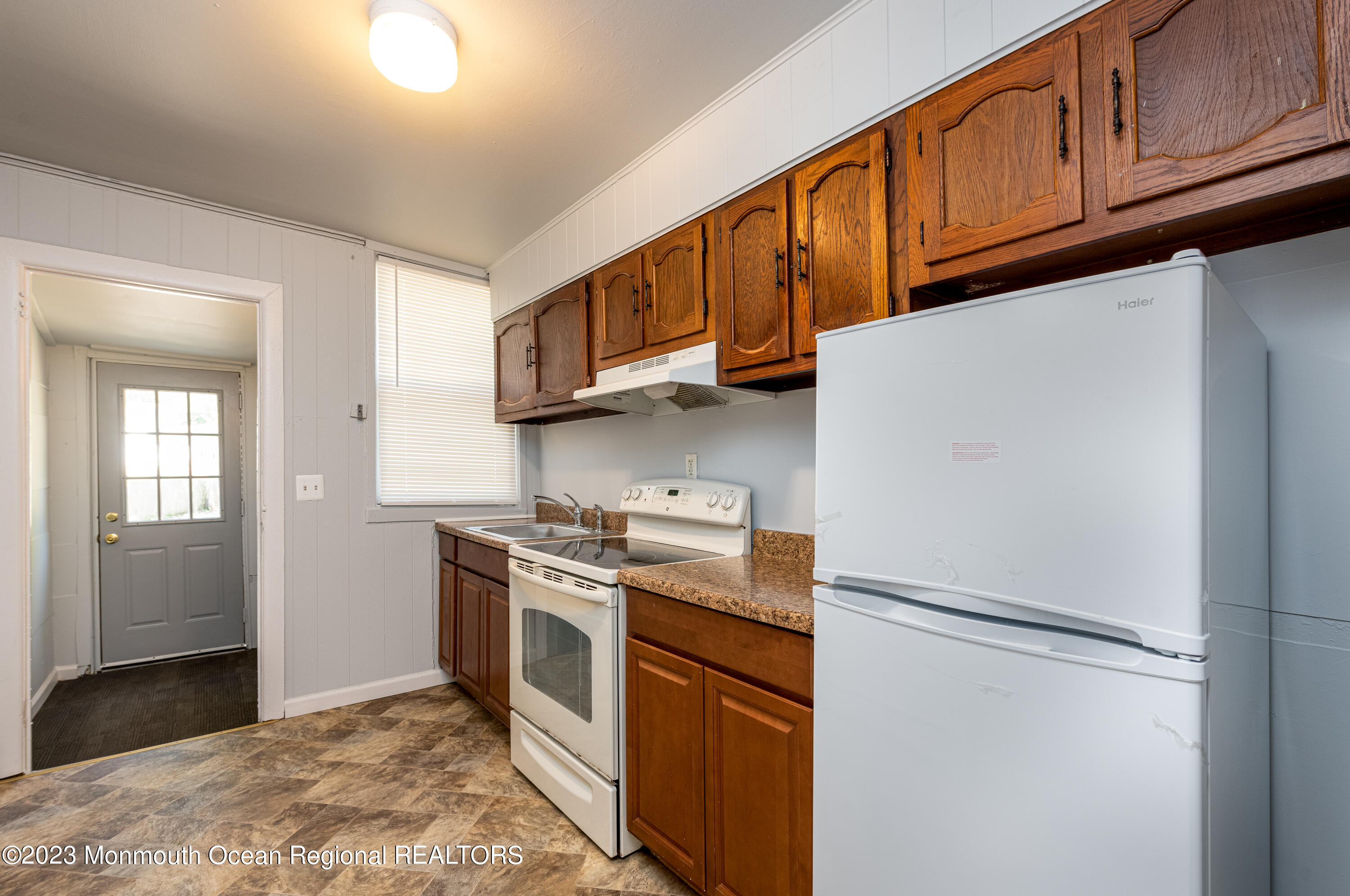 508 Georgia Tavern Road Howell, NJ 07731 - Photo 9 of 33 a kitchen with stainless steel appliances granite countertop a refrigerator a stove a sink and a microwave