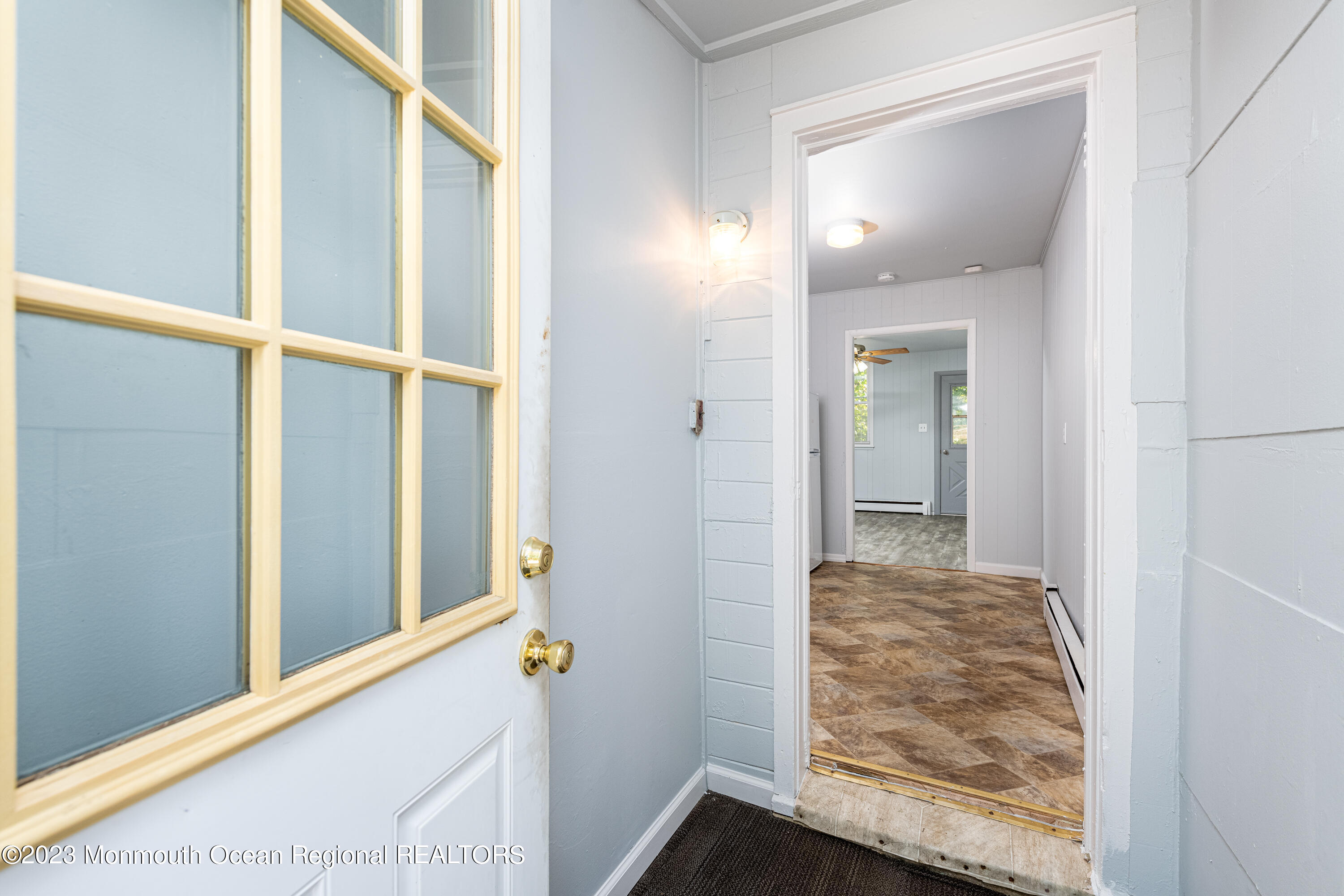 508 Georgia Tavern Road Howell, NJ 07731 - Photo 10 of 33 a view of a hallway with wooden floor and staircase