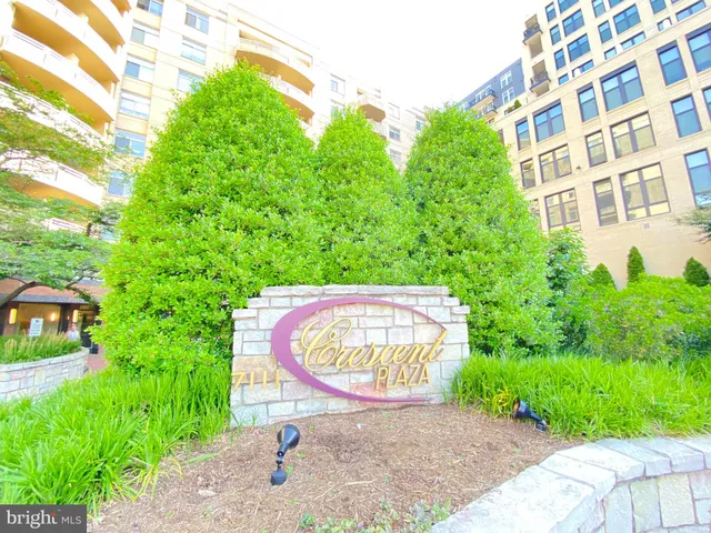 a view of a bench in wooden floor