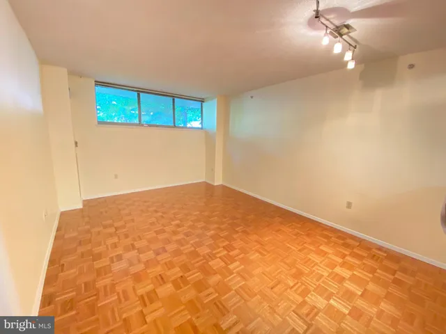 a view of a kitchen with a sink and cabinets