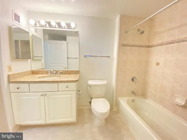 a living room with kitchen island granite countertop furniture and a fireplace