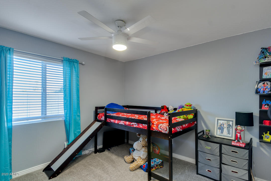 1775 East Grandview Road Phoenix, AZ 85022 - Photo 24 of 37 a bedroom with furniture and a wooden floor