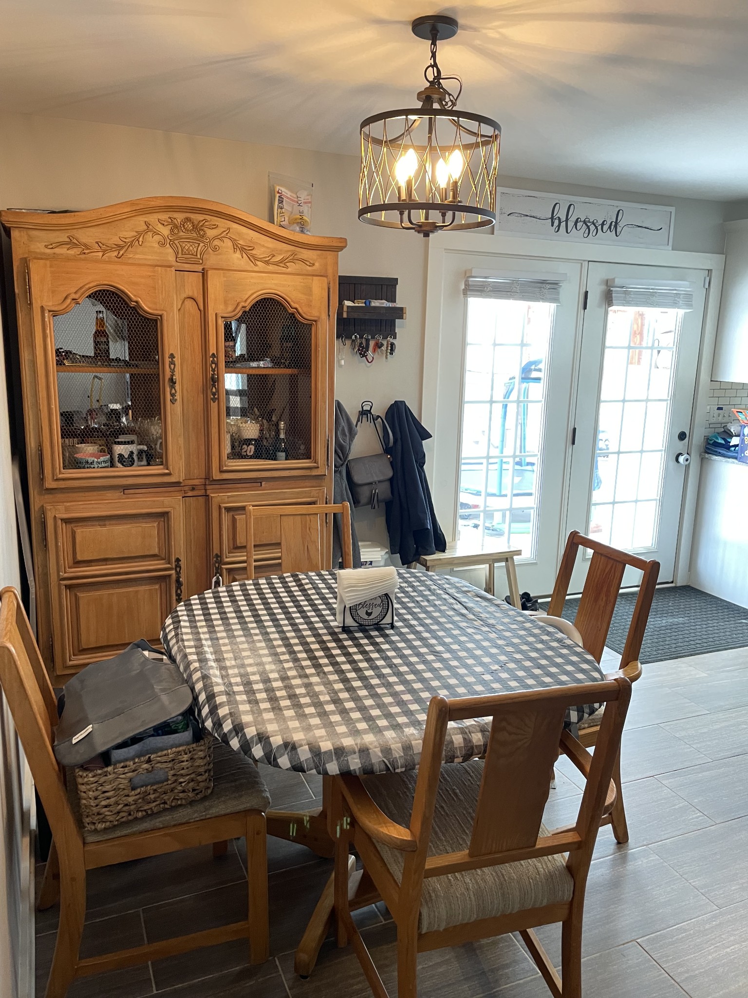 3716 Baggett Road Springfield, TN 37172 - Photo 15 of 40 a dining room with wooden floor a chandelier a wooden table and chairs