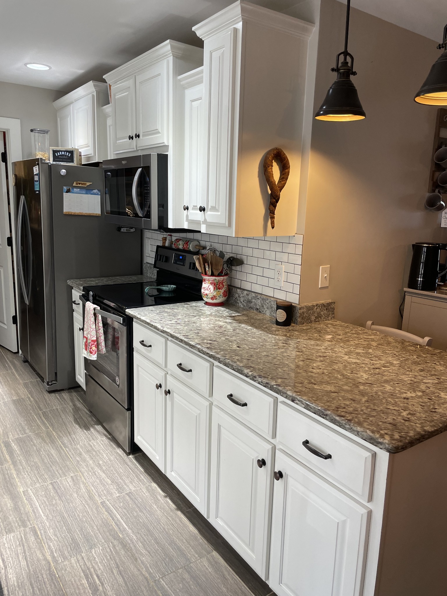3716 Baggett Road Springfield, TN 37172 - Photo 10 of 40 a kitchen with stainless steel appliances granite countertop a sink dishwasher a refrigerator and cabinets with wooden floor