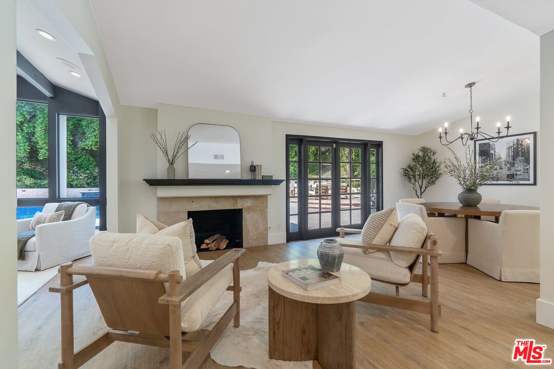 22801 Pera Road Woodland Hills, CA 91364 - Photo 13 of 46 a living room with furniture and a fireplace