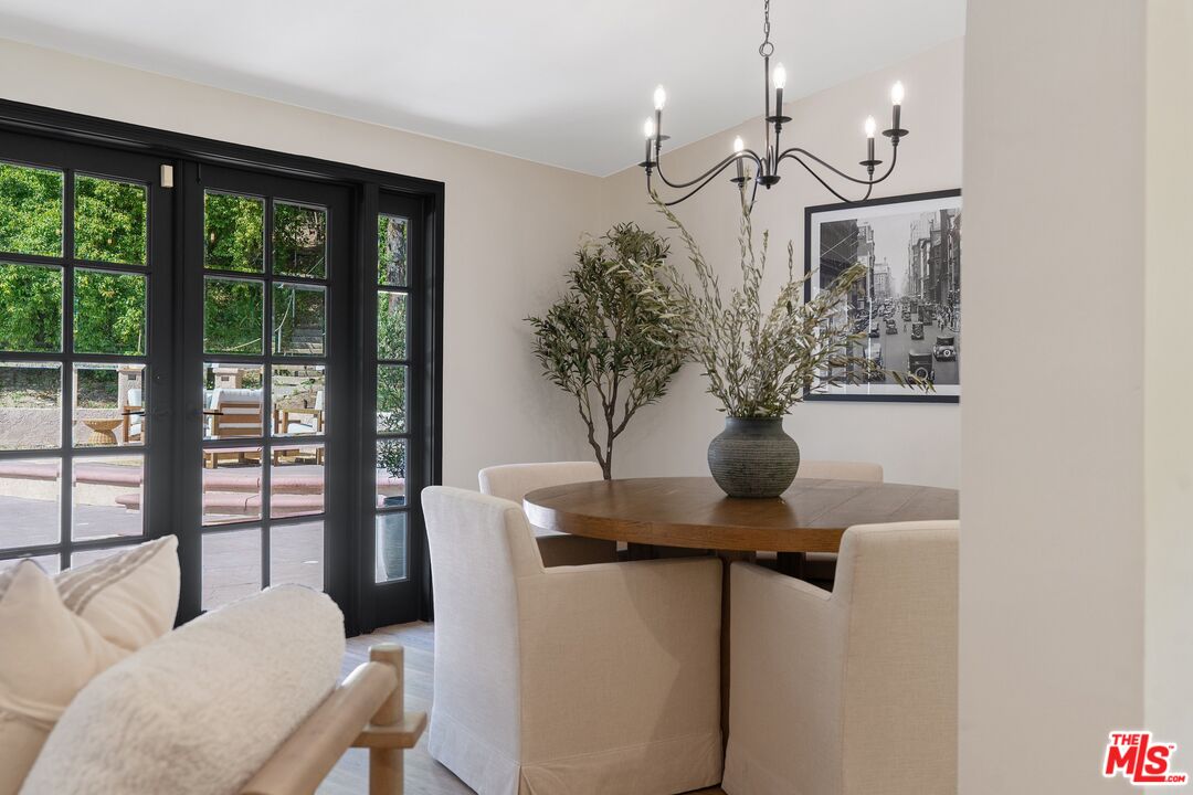 22801 Pera Road Woodland Hills, CA 91364 - Photo 14 of 46 a view of a living room with furniture and a potted plant